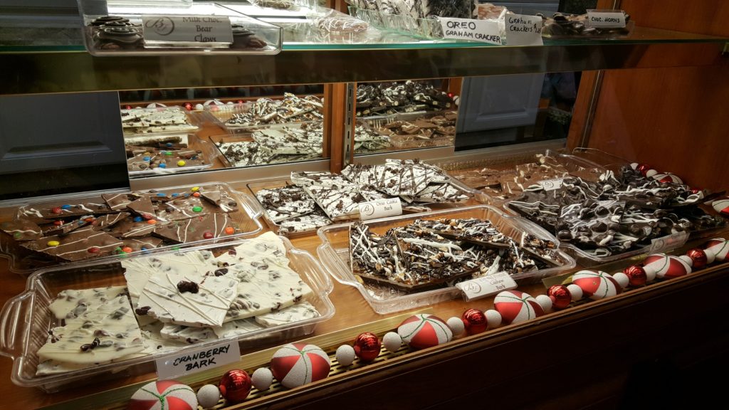 A display case filled with lots of different types of desserts.