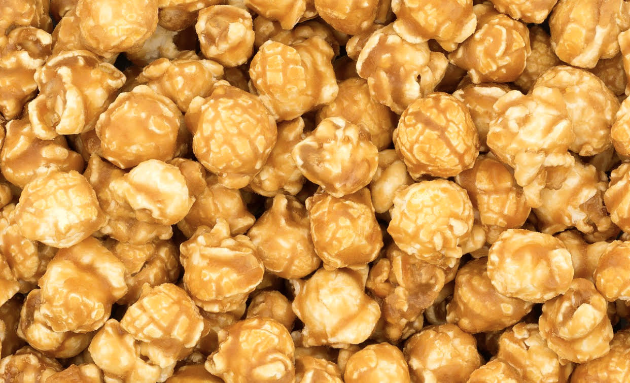 A close up of popcorn covered in caramel