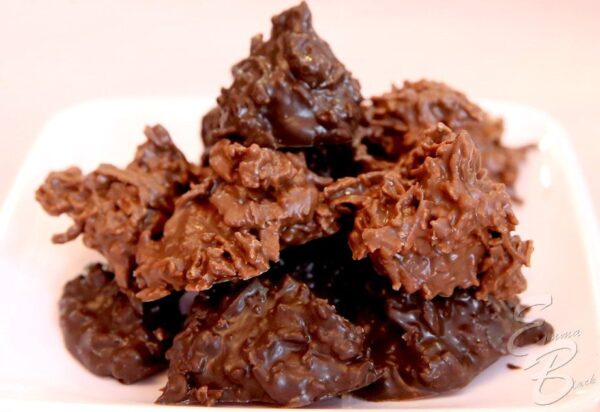 A close up of some chocolate cookies on a plate