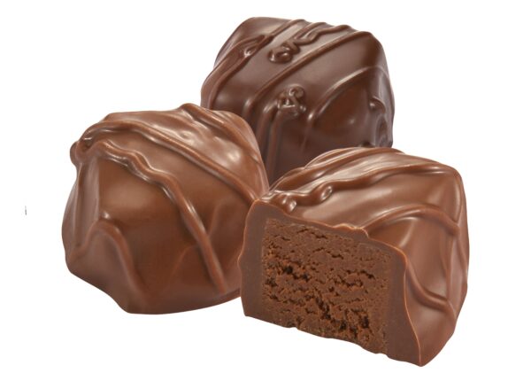 A close up of three chocolate covered candies