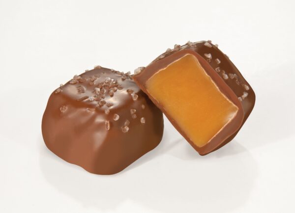 A close up of two pieces of caramel